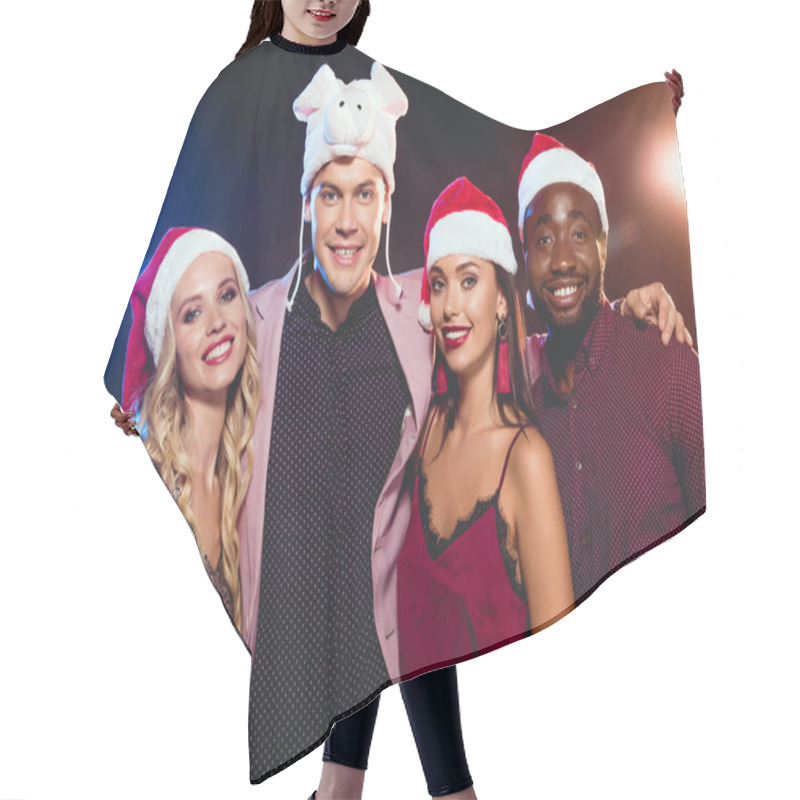 Personality  Smiling Man In Pig Hat Posing With Multicultural Friends In Santa Hats On Black With Backlit  Hair Cutting Cape