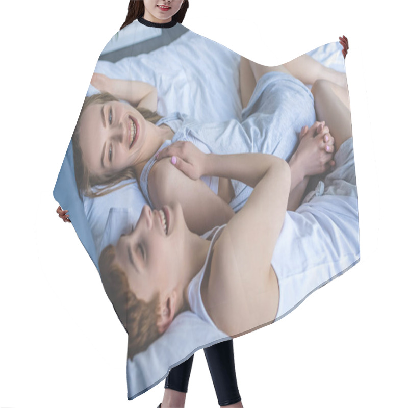 Personality  Young Lesbian Couple Laughing While Relaxing In Bed Hair Cutting Cape