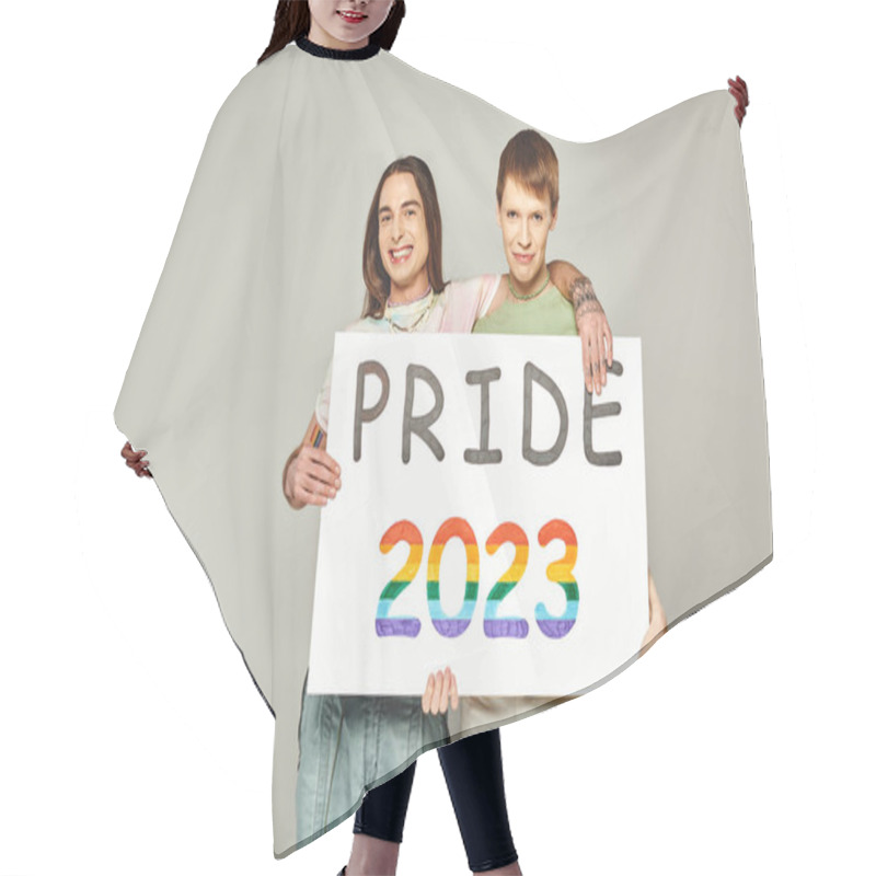 Personality  Cheerful Lgbt Friends Holding Pride 2023 Placard And Looking At Camera While Celebrating Lgbtq Community Holiday In June On Grey Background In Studio  Hair Cutting Cape