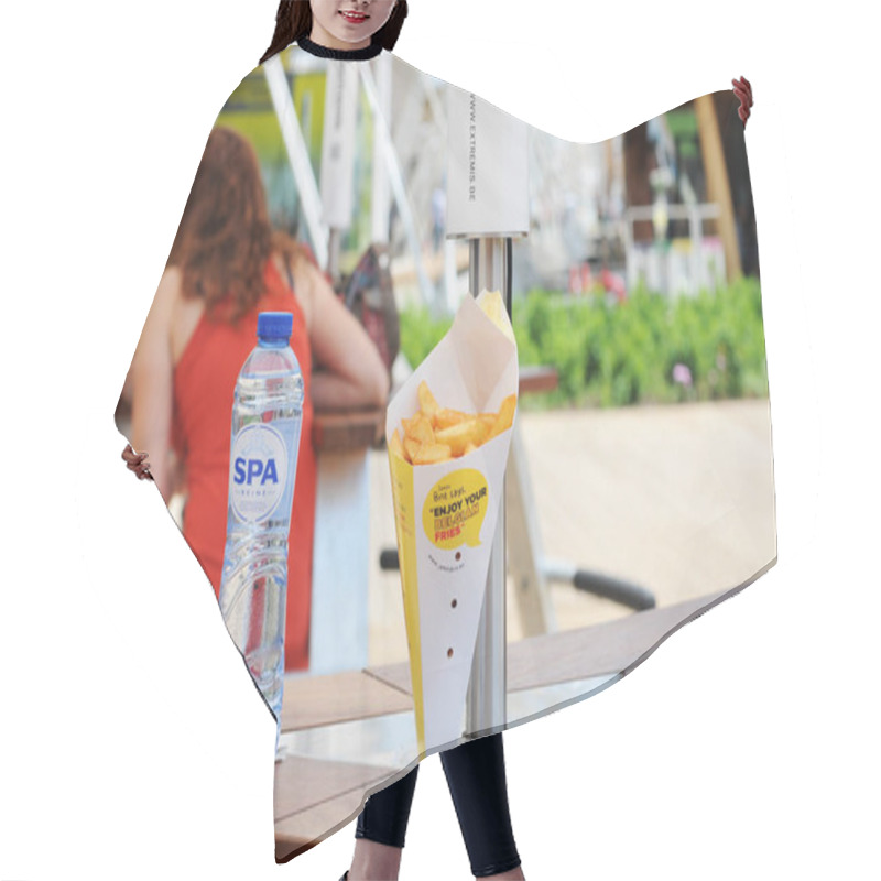 Personality  MILAN ITALY MAY 28 2015 Expo 2015 Belgian Pavilion, Fries And Spa Mineral Water Hair Cutting Cape