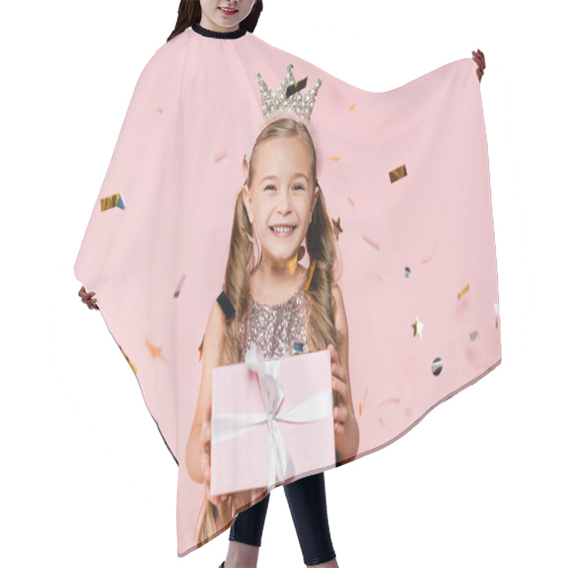 Personality  Happy Little Girl In Crown Holding Present Near Falling Confetti On Pink  Hair Cutting Cape