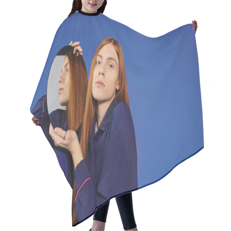 Personality  A Young Man With Long Red Hair Poses Confidently With A Stylish Mirror Reflecting Him. Hair Cutting Cape