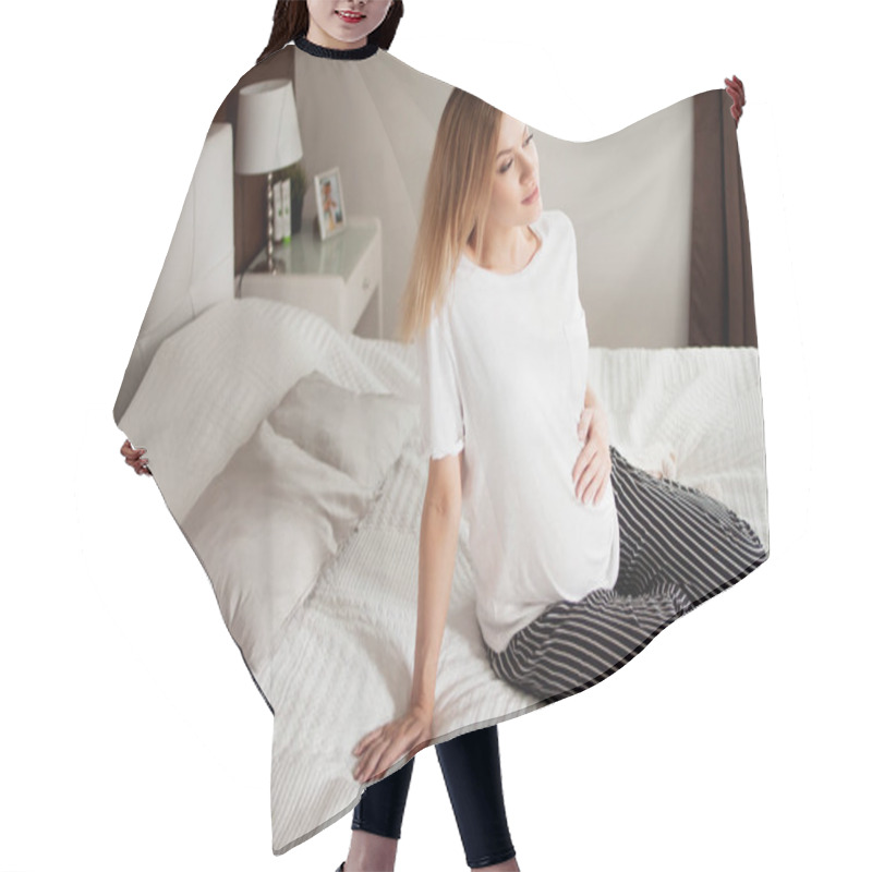 Personality  Calm Pregnant Happy Woman Is Sitting On A Light Bed With Pillows, Legs Crossed, Resting, Thinking. Hair Cutting Cape