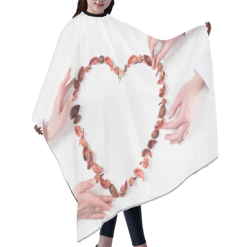 Personality  Cropped Image Of Couple Making Heart From Dried Fruits On Valentines Day Isolated On White Hair Cutting Cape