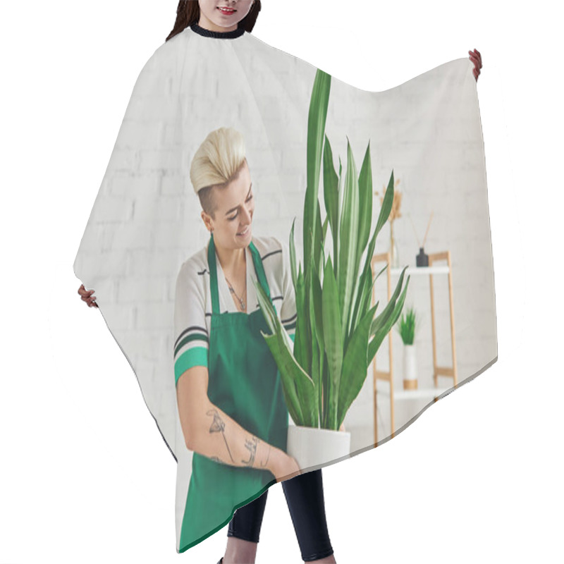 Personality  Young And Cheerful Tattooed Woman With Trendy Hairstyle Holding Exotic Plant In Flowerpot In Modern Apartment, Eco-conscious Mindset, Sustainable Home Decor And Green Living Concept Hair Cutting Cape