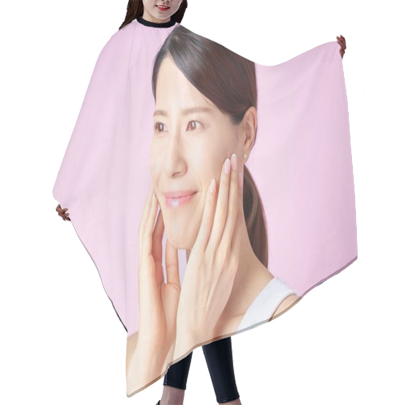 Personality  A Woman Checking Her Skin Condition With A Pink Background Hair Cutting Cape