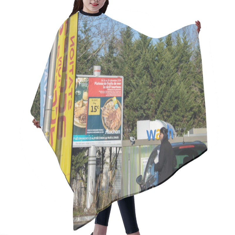 Personality  France, 16 December 2024 : Man Walking Near Promotional Billboard At Car Wash Station Hair Cutting Cape