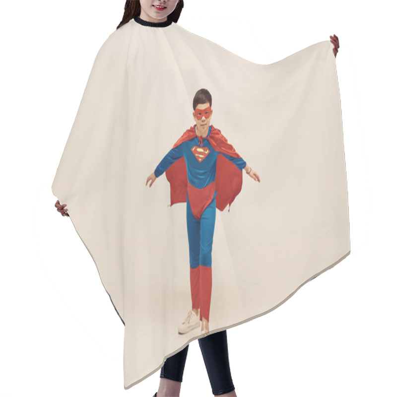 Personality  Courageous Asian Boy In Red And Blue Superhero Costume With Cloak And Mask On Face Celebrating International Day For Protection Of Children On Grey Background  Hair Cutting Cape