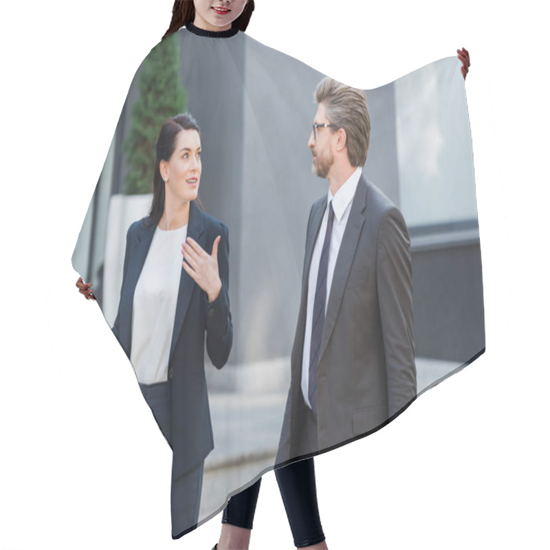 Personality  Attractive Diplomat Gesturing While Looking At Man In Glasses And Holding Folder  Hair Cutting Cape