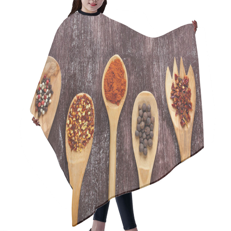 Personality  Various Spices In Wooden Spoons On Dark Brown Background. Differ Hair Cutting Cape