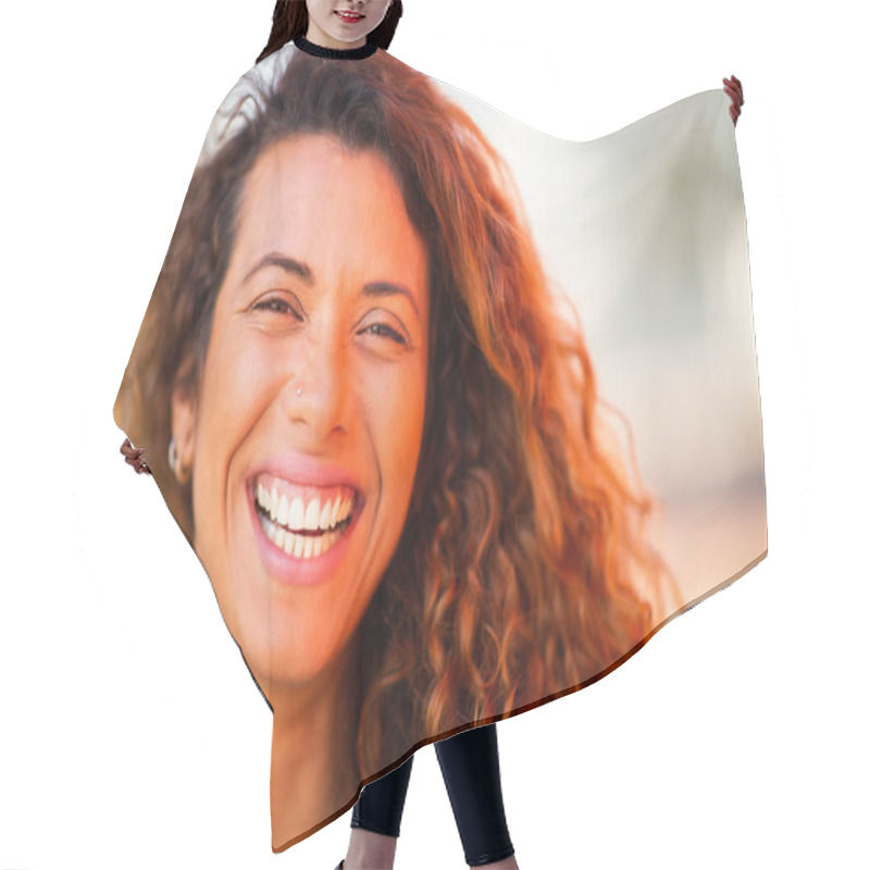 Personality  Close Up Portrait Of Smiling Young Hispanic Woman Looking At Camera And Laughing Outside Hair Cutting Cape