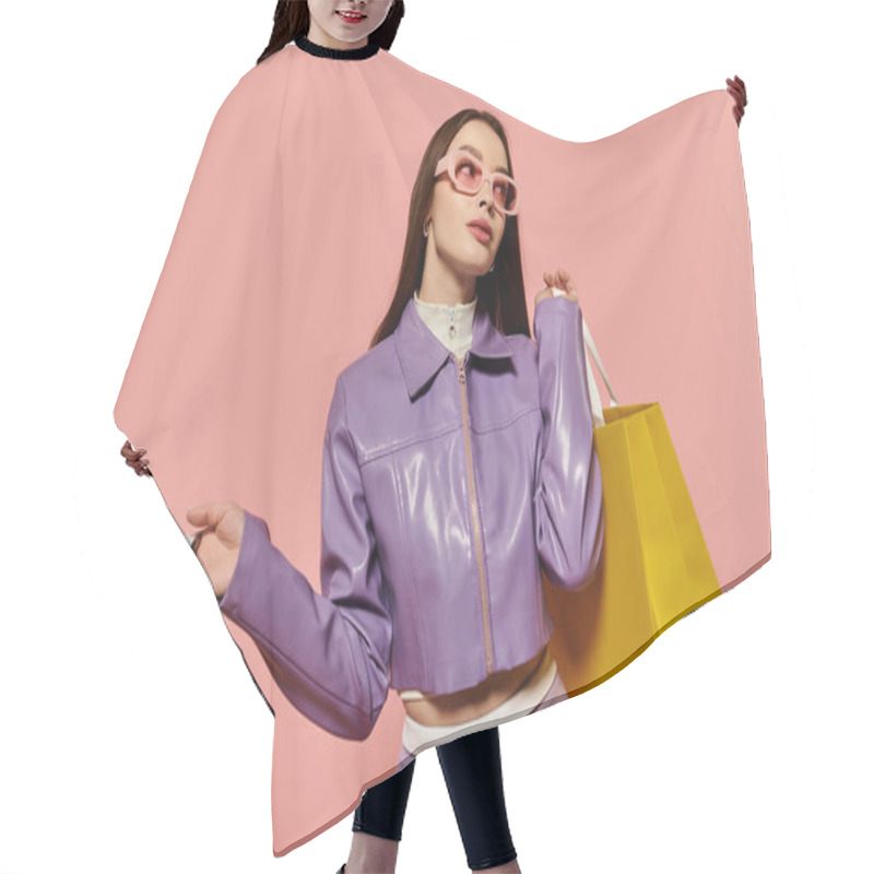 Personality  Trendy Woman Poses Confidently With Shopping Bags Against A Pink Backdrop. Hair Cutting Cape