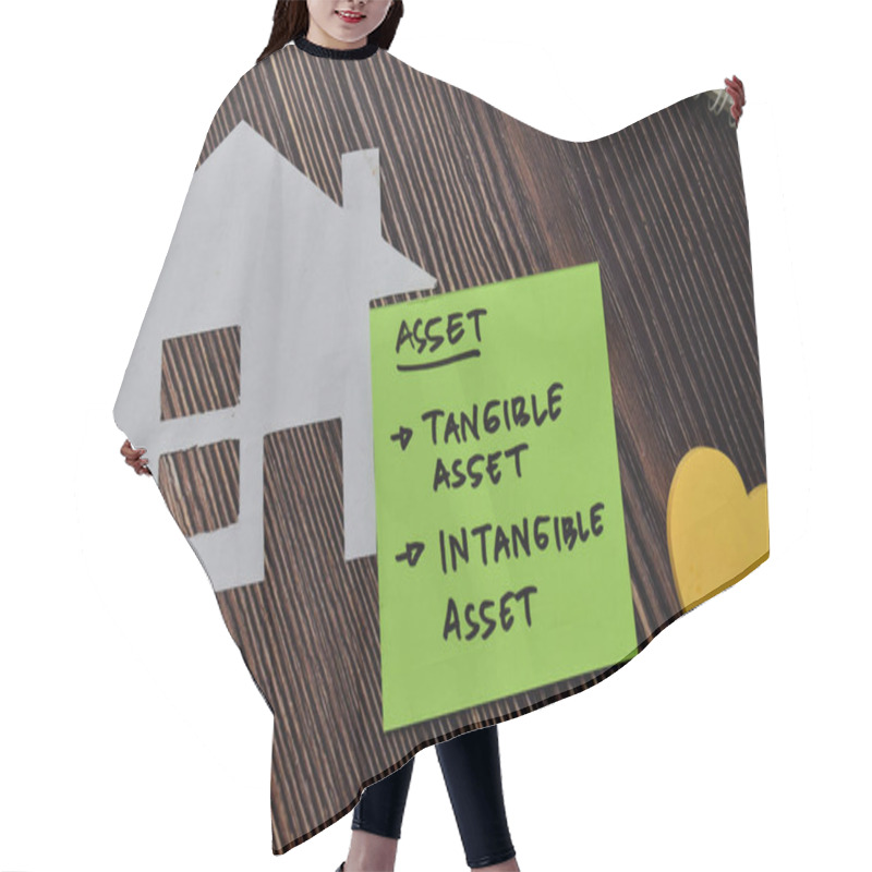 Personality  Asset - Tangible Asset And Intangible Asset Write On Sticky Notes Isolated On Wooden Table. Hair Cutting Cape