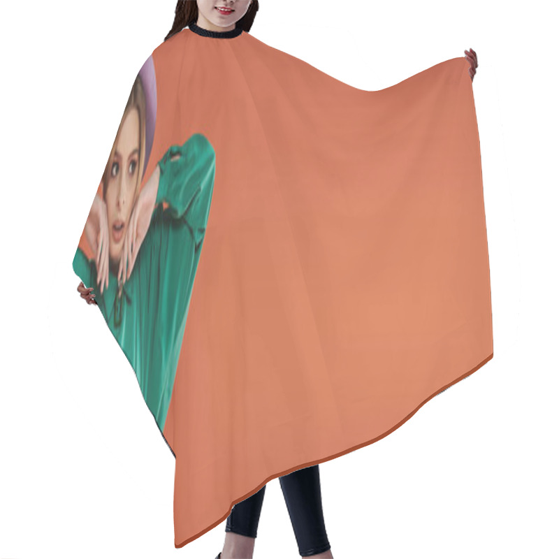 Personality  A Woman With A Stylish, Grunge Look Poses Against A Bright Orange Background. Hair Cutting Cape