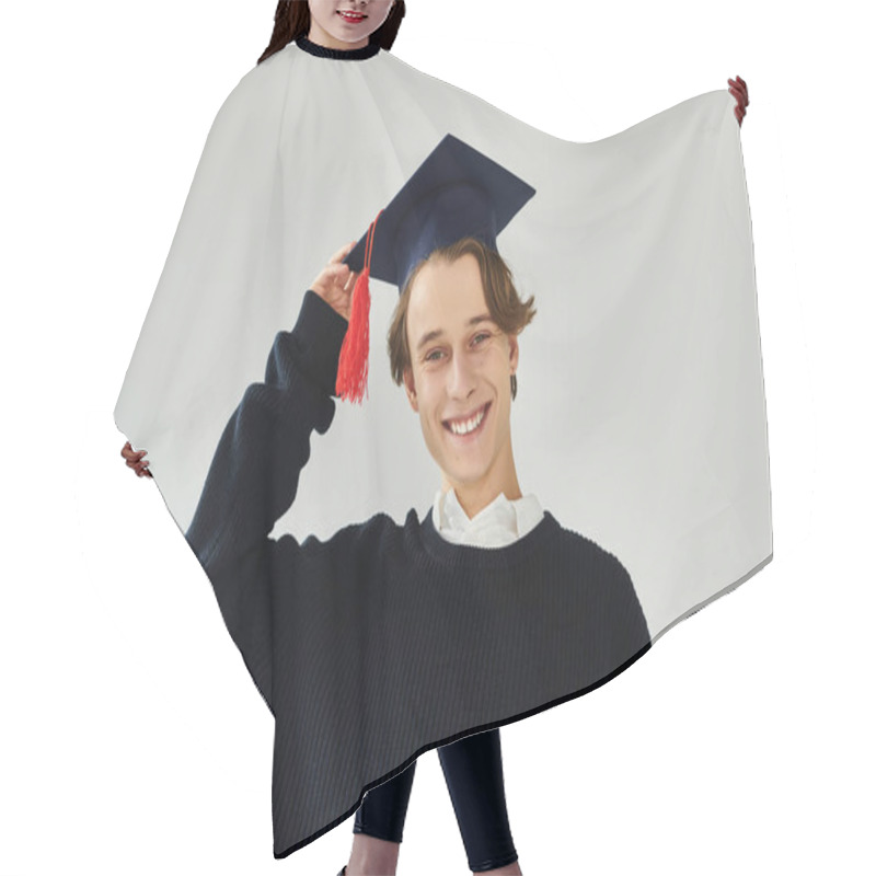 Personality  A Young Man Proudly Wearing A Graduation Cap And Smiling In A Stylish Studio Setting. Hair Cutting Cape