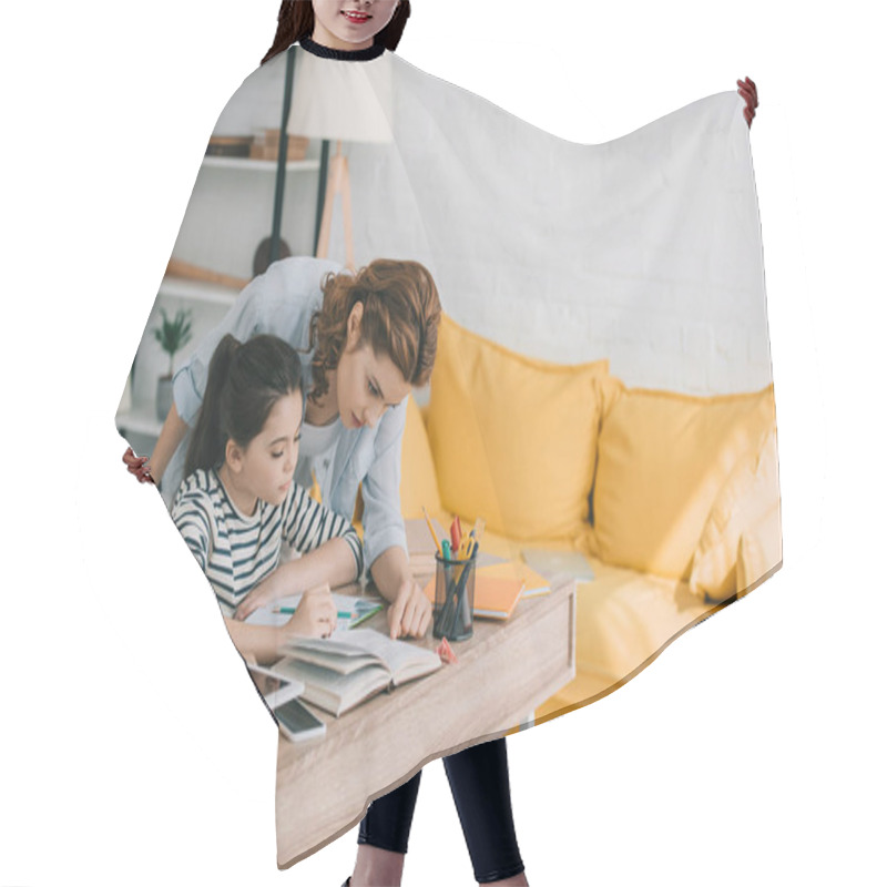 Personality  Beautiful Woman Helping Adorable Daughter Doing Schoolwork At Home Hair Cutting Cape