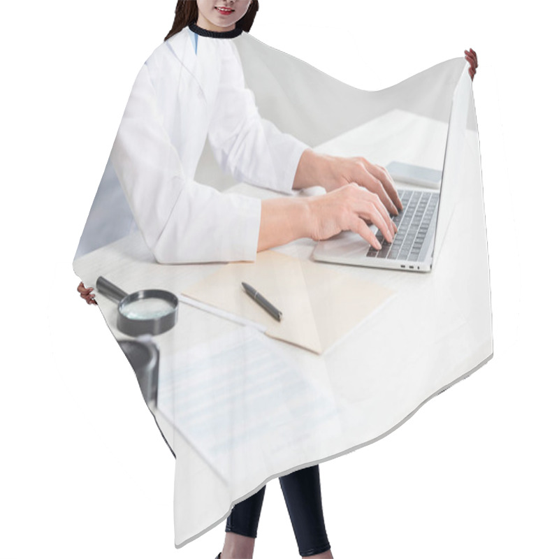 Personality  Cropped View Of Nutritionist Sitting At Table And Using Laptop In Clinic  Hair Cutting Cape