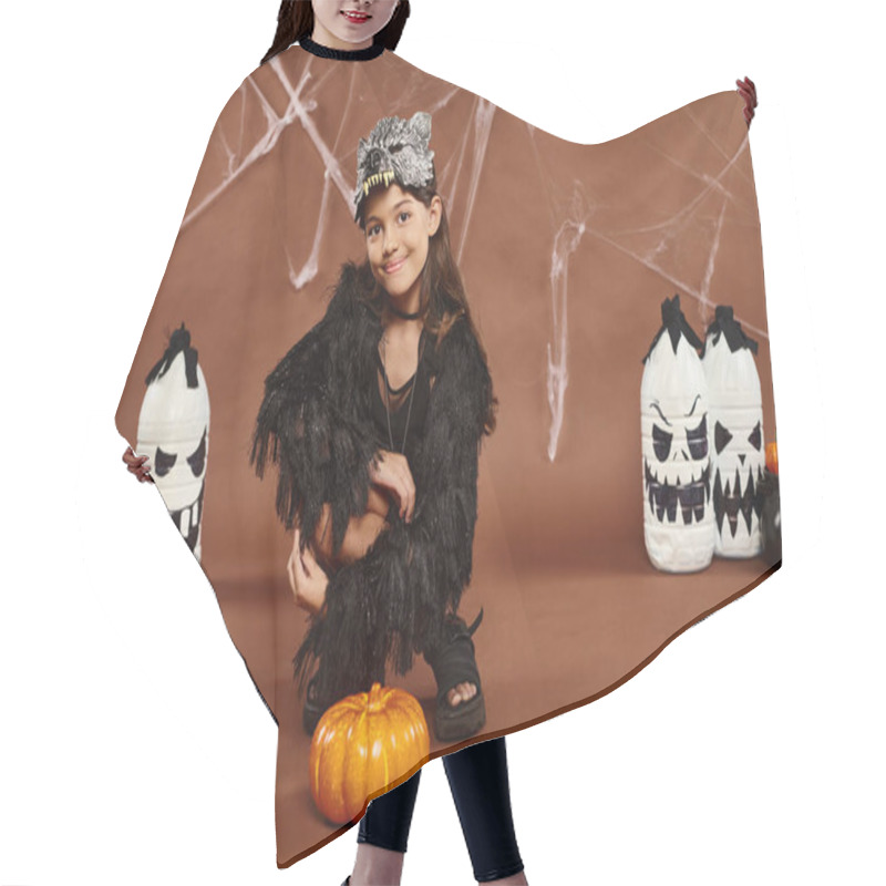 Personality  Cheerful Preteen Girl Squatting Near Pumpkin With Lanterns And Spiderweb On Backdrop, Halloween Hair Cutting Cape