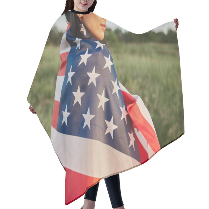 Personality  4th Of July. Fourth Of July. American Woman With The National American Flag Against Beautiful Landmark. Independence Day. Beautiful Sunset Light. Patriotic Holiday, Democracy Respect And Veteran Respect Concept Hair Cutting Cape