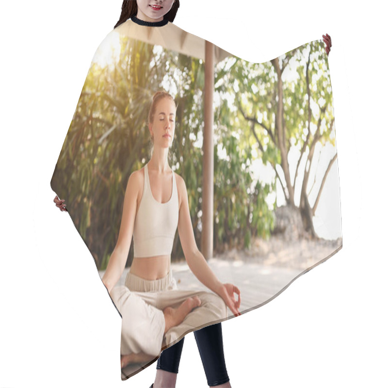 Personality  Young Barefoot Female Sitting In Lotus Pose On Wooden Floor Of Terrace And Meditating With Closed Eyes During Yoga Session On Beach In Summer Hair Cutting Cape