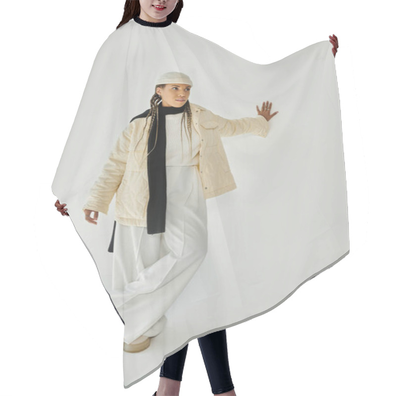 Personality  Appealing Young Woman In Stylish Warm Attire Posing On White Backdrop. Hair Cutting Cape