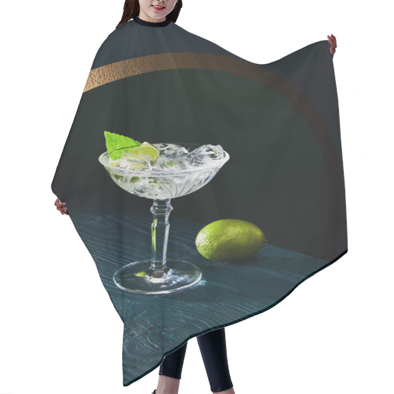 Personality  High Angle View Of Cocktail Glass With Ice, Mint Leaf And Whole Lime On Blue Wooden Background Hair Cutting Cape