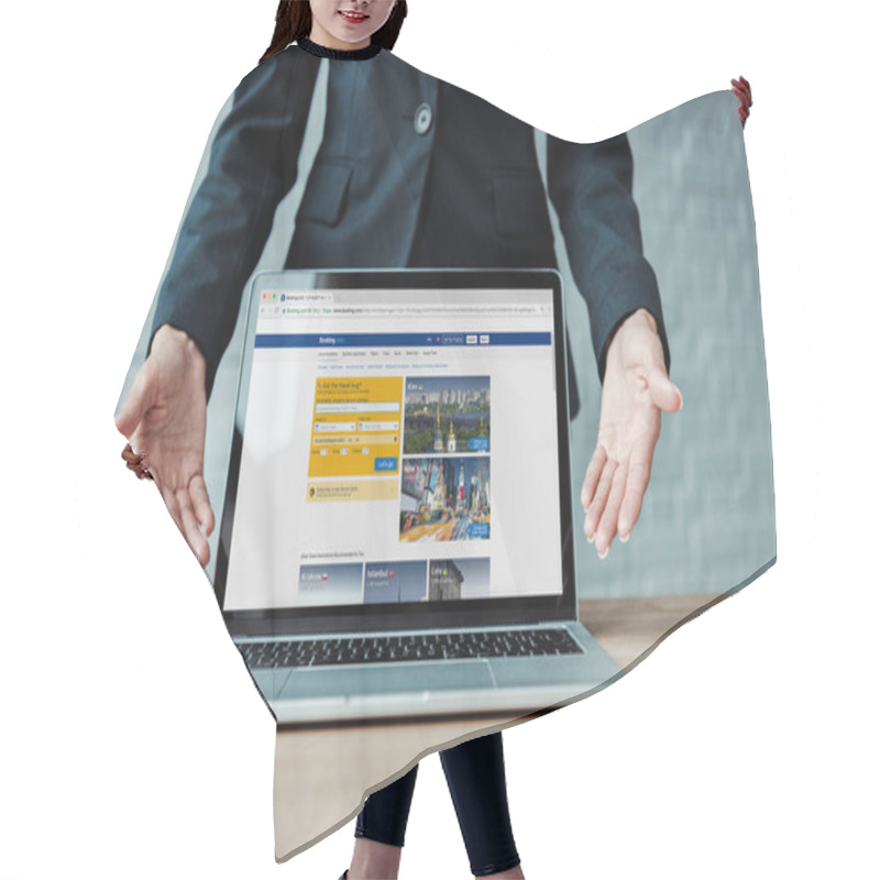 Personality  KYIV, UKRAINE - AUGUST 5, 2019: Cropped View Of Woman Gesturing Near Laptop With Booking Website On Screen  Hair Cutting Cape