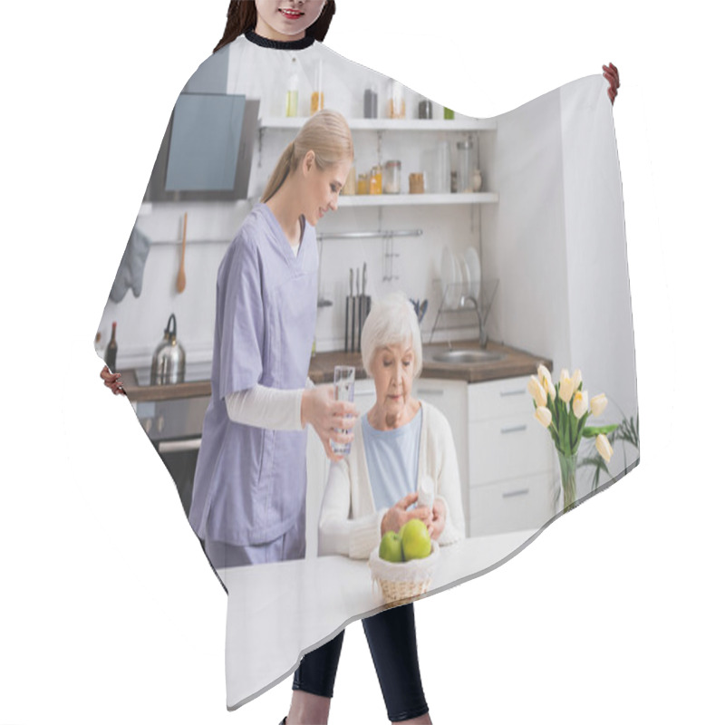 Personality  Young Nurse Giving Glass Of Water To Elderly Woman Holding Pills Container In Kitchen Hair Cutting Cape