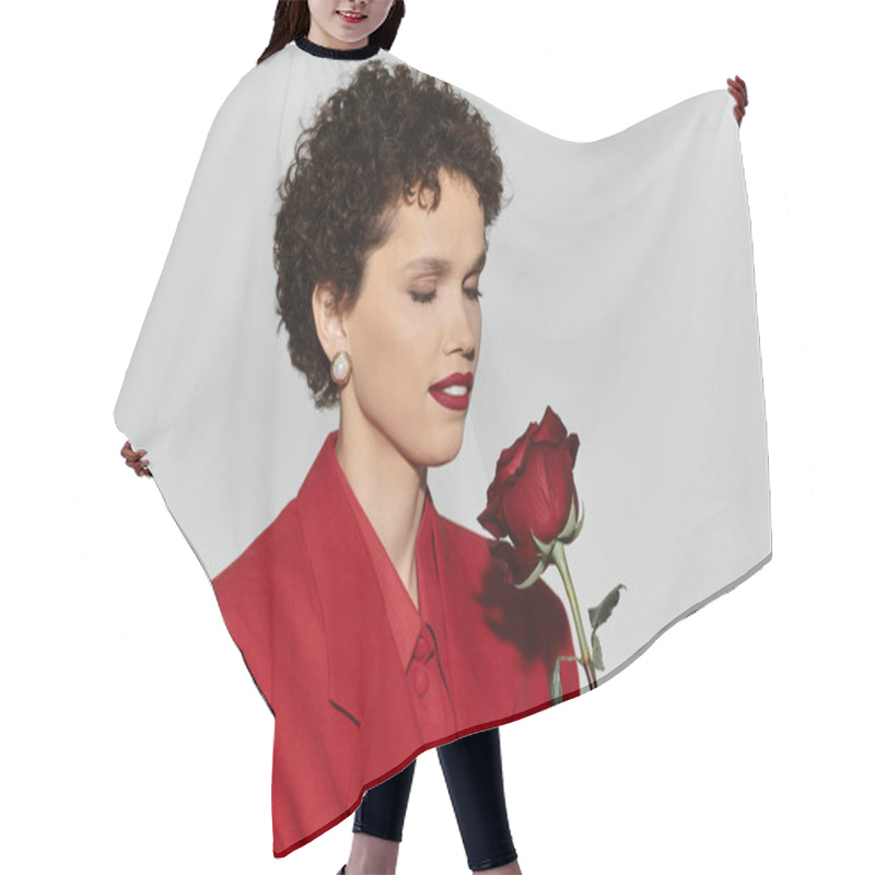 Personality  A Beautiful Woman Exudes Charm While Gently Holding A Red Rose, Showcasing Her Elegant Style. Hair Cutting Cape