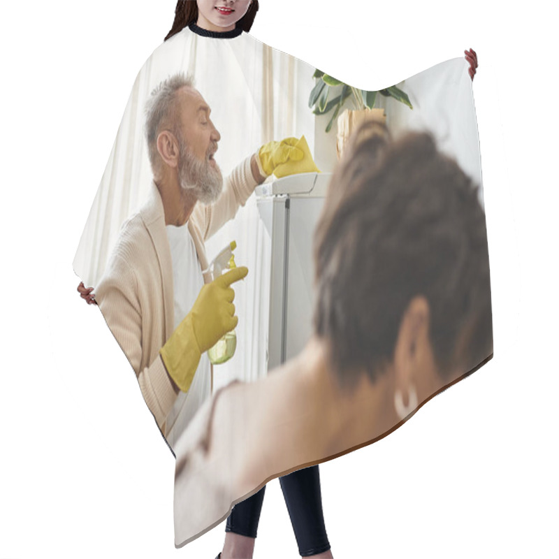 Personality  Mature Couple Shares Joyful Moments While Cleaning And Tending To Their Indoor Plants. Hair Cutting Cape