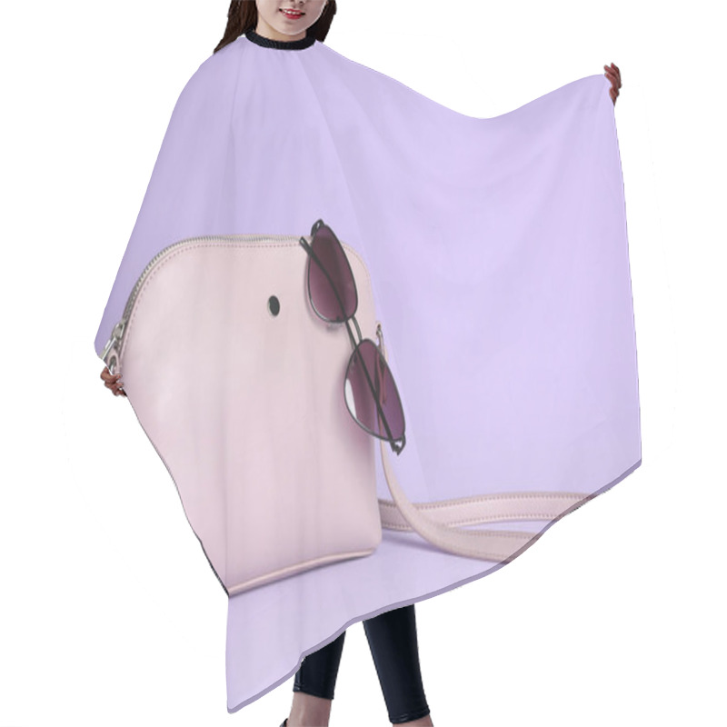 Personality  Stylish Woman's Bag And Sunglasses On Lilac Background. Space For Text Hair Cutting Cape