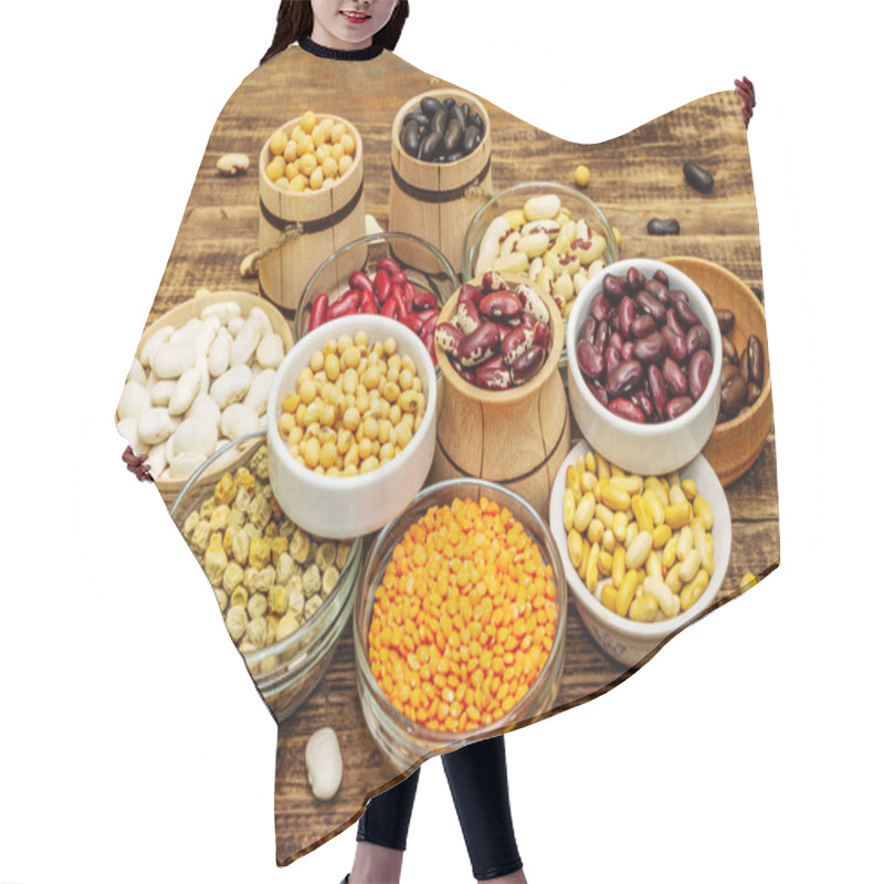 Personality  Set Of Various Dry Legumes In Bowls, Indispensable Protein For A Healthy Lifestyle. Assorted Different Types Of Beans. Wooden Table Background, Close Up Hair Cutting Cape