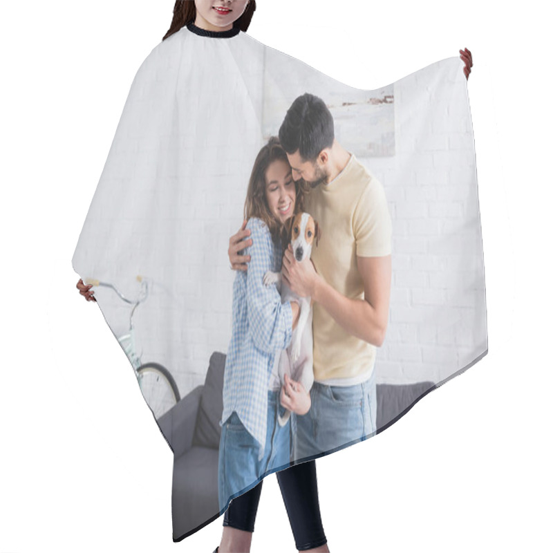 Personality  Happy Multiethnic Couple Hugging With Jack Russell Terrier In Modern Living Room Hair Cutting Cape