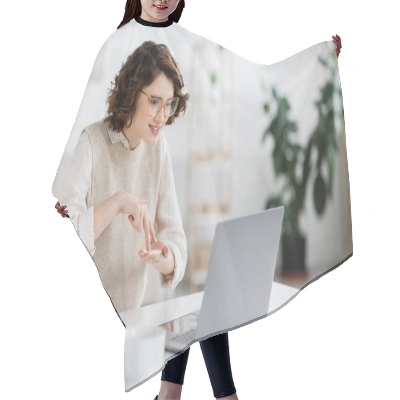 Personality  Curly Woman Showing Stand Word While Teaching Sign Language During Online Lesson On Laptop  Hair Cutting Cape