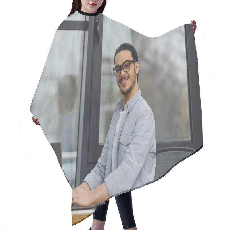 Personality  A Man Focuses On His Laptop While Sitting At A Desk. Hair Cutting Cape