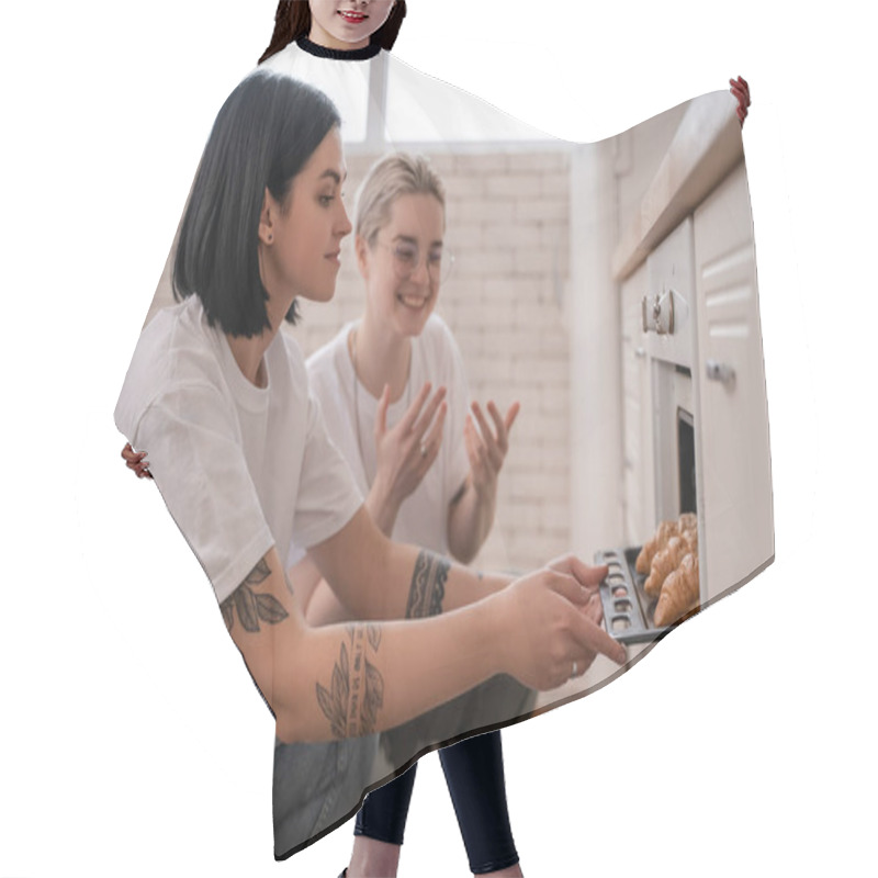 Personality  Tattooed Lesbian Couple Taking Oven Tray With Freshly Baked Croissants In Kitchen  Hair Cutting Cape