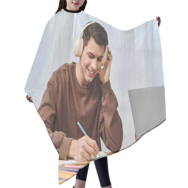 Personality  A Young Man Is Happily Writing Notes While Enjoying Music In A Warm, Inviting Atmosphere At Home. Hair Cutting Cape