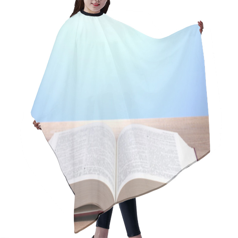 Personality  Open Book On Wooden Table On Blue Background Hair Cutting Cape