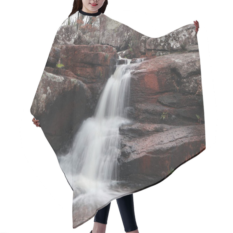 Personality  A Serene Waterfall Cascades Over Weathered Red Rocks, Surrounded By Lush Greenery, Creating A Tranquil And Inviting Scene.    Hair Cutting Cape