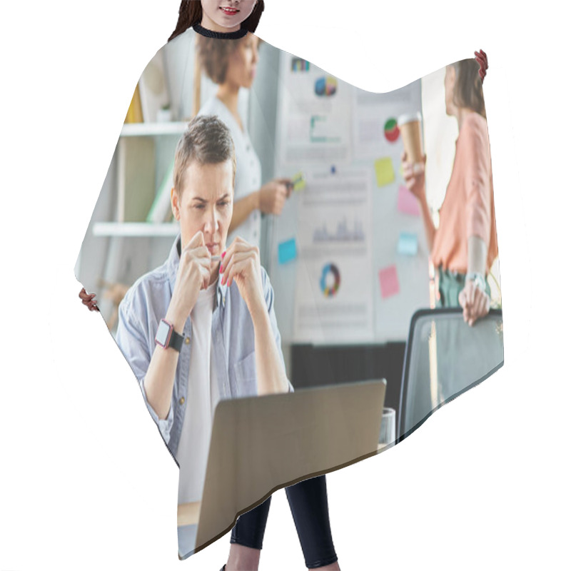 Personality  A Businesswoman Engrossed In Work On A Laptop Computer, With Her Diverse Colleagues On Backdrop. Hair Cutting Cape