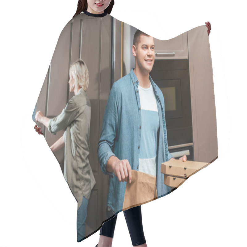 Personality  Smiling Man With Pizza Boxes And Package Near Girlfriend Closing Door At Home Hair Cutting Cape