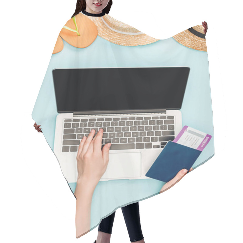 Personality  Cropped View Of Woman Using Laptop With Blank Screen And Holding Passport With Air Ticket Near Straw Hats And Flip Flops On Blue Background Hair Cutting Cape