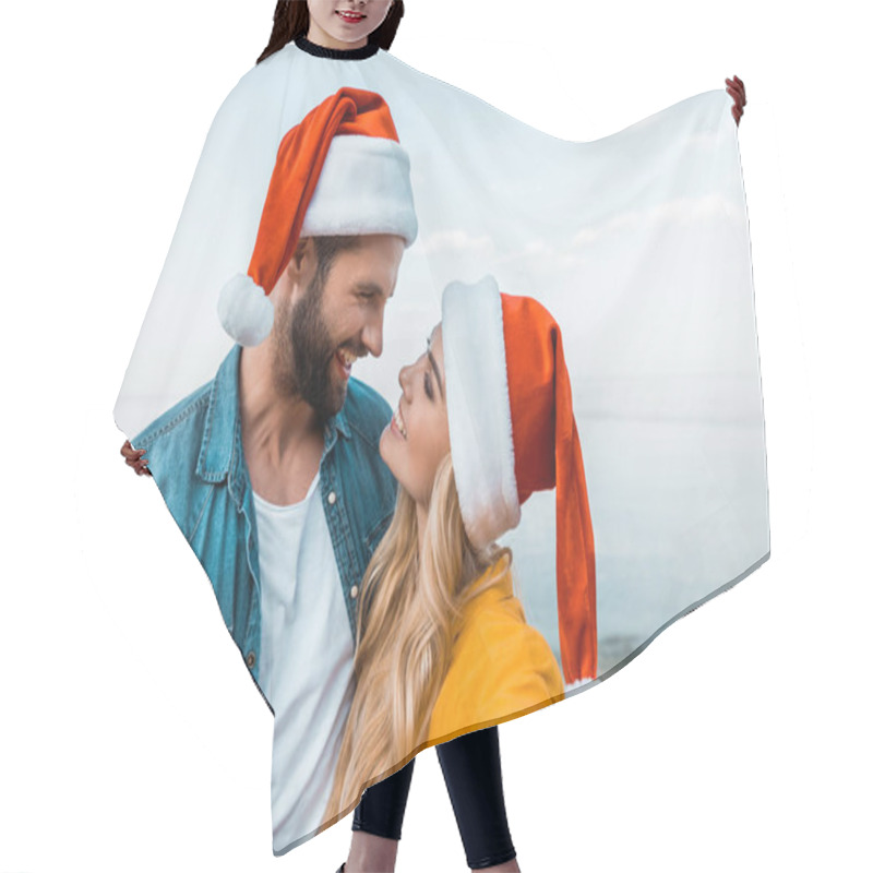 Personality  Smiling Couple In Santa Hats Hugging On Beach And Looking At Each Other Hair Cutting Cape