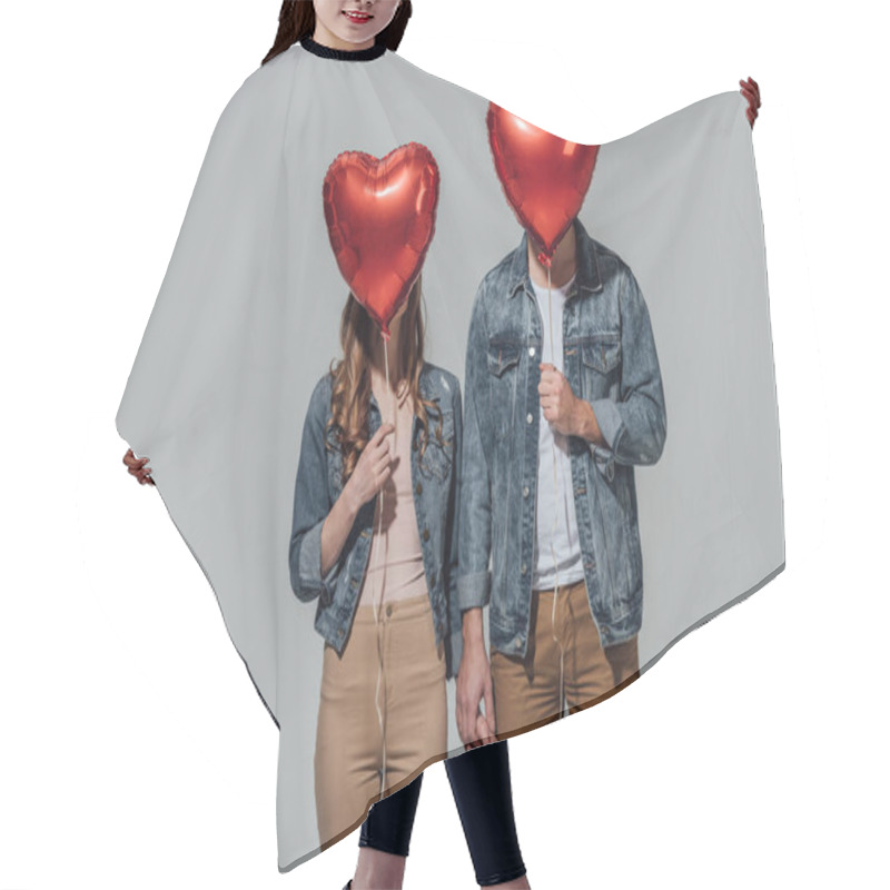 Personality  Young Couple Hiding Faces Behind Red Heart Shaped Balloons Isolated On Grey Hair Cutting Cape