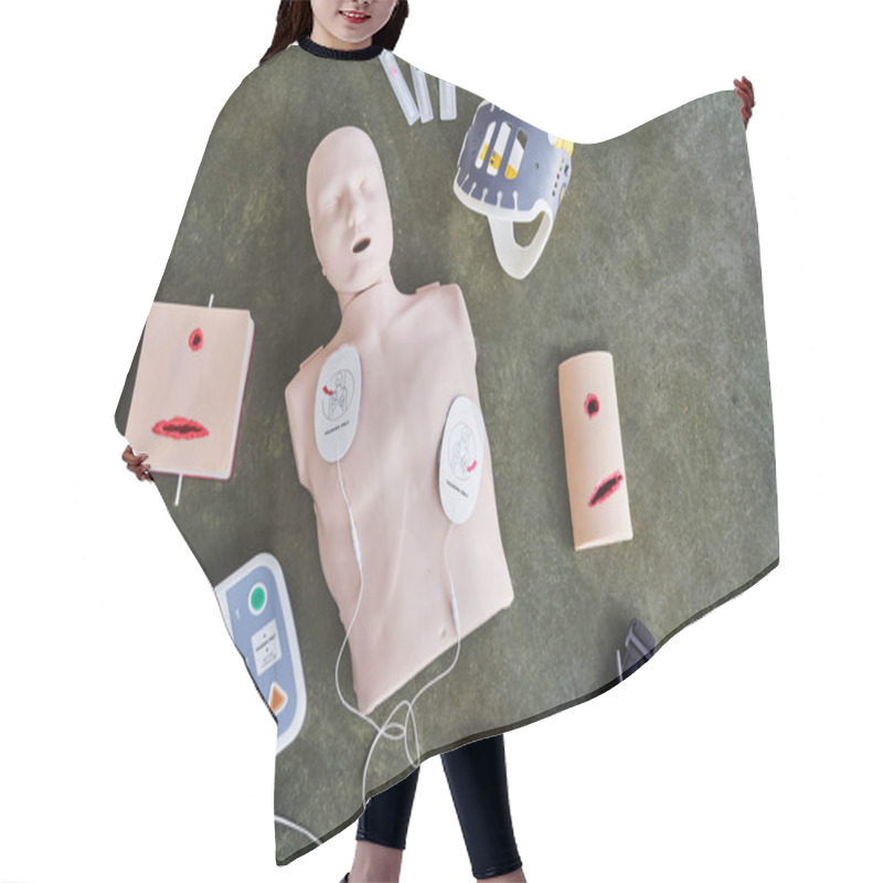 Personality  Top View Of CPR Manikin, Automated External Defibrillator, Wound Care Simulators, Neck Brace, Syringes, Compression Tourniquet And Bandage, Medical Equipment For First Aid Training  Hair Cutting Cape