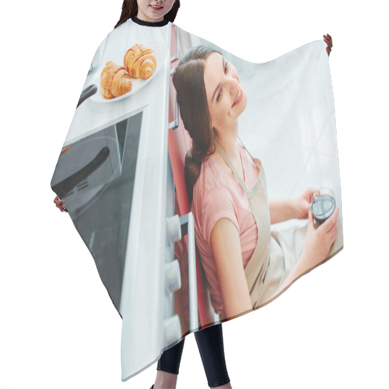 Personality  Happy Young Lady Leaning With Her Back On A Kitchen Cabinetry Smiling While Sitting On The Floor With Coffee Hair Cutting Cape