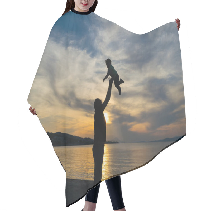 Personality  Silhouette Of A Father And His Son Against The Sunset With A Dramatic Sky. Hair Cutting Cape