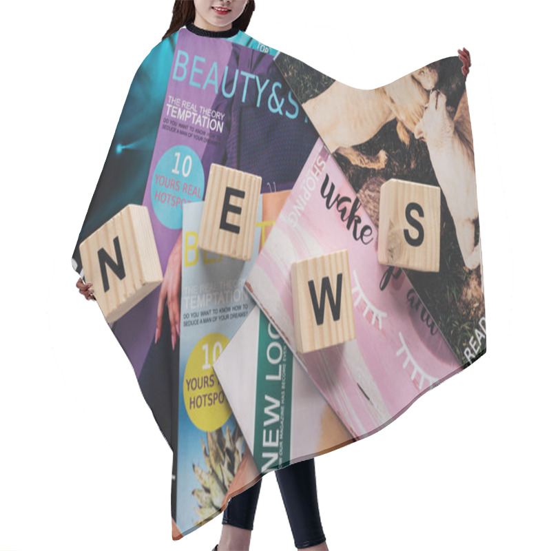 Personality  Top View Of Pile Of Different Tabloid Magazines And Wooden Cubes With Word News On Surface Hair Cutting Cape