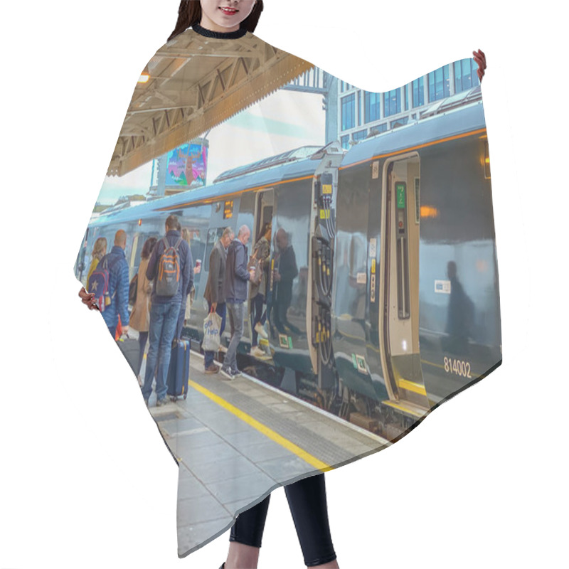 Personality  CARDIFF, WALES - SEPTEMBER 2019: Passengers Boarding A London-bound Great Western Railway Inter City Express At Cardiff Central Railway Station Hair Cutting Cape