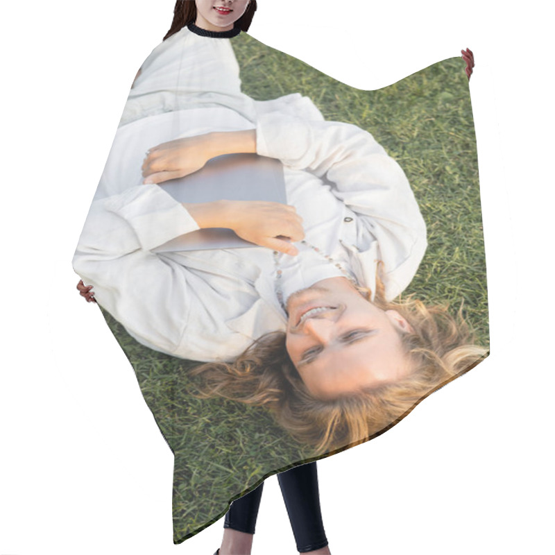 Personality  Top View Of Carefree Yoga Man In Linen Clothes Lying On Green Grassy Field And Holding Laptop Hair Cutting Cape